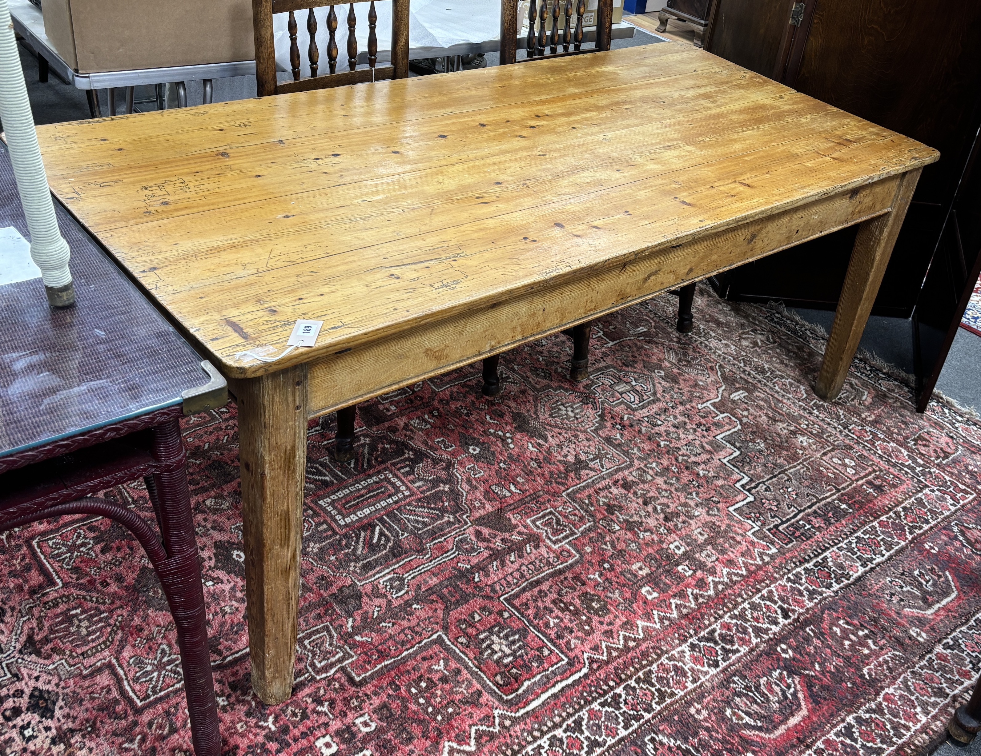 A 19th century rectangular pine kitchen table, width 182cm, depth 88cm, height 71cm. Condition - fair